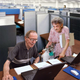 Supervisor Gladys Schiele, 93, inspects the work of data-entry clerk Jack Vandenbogen, 87.